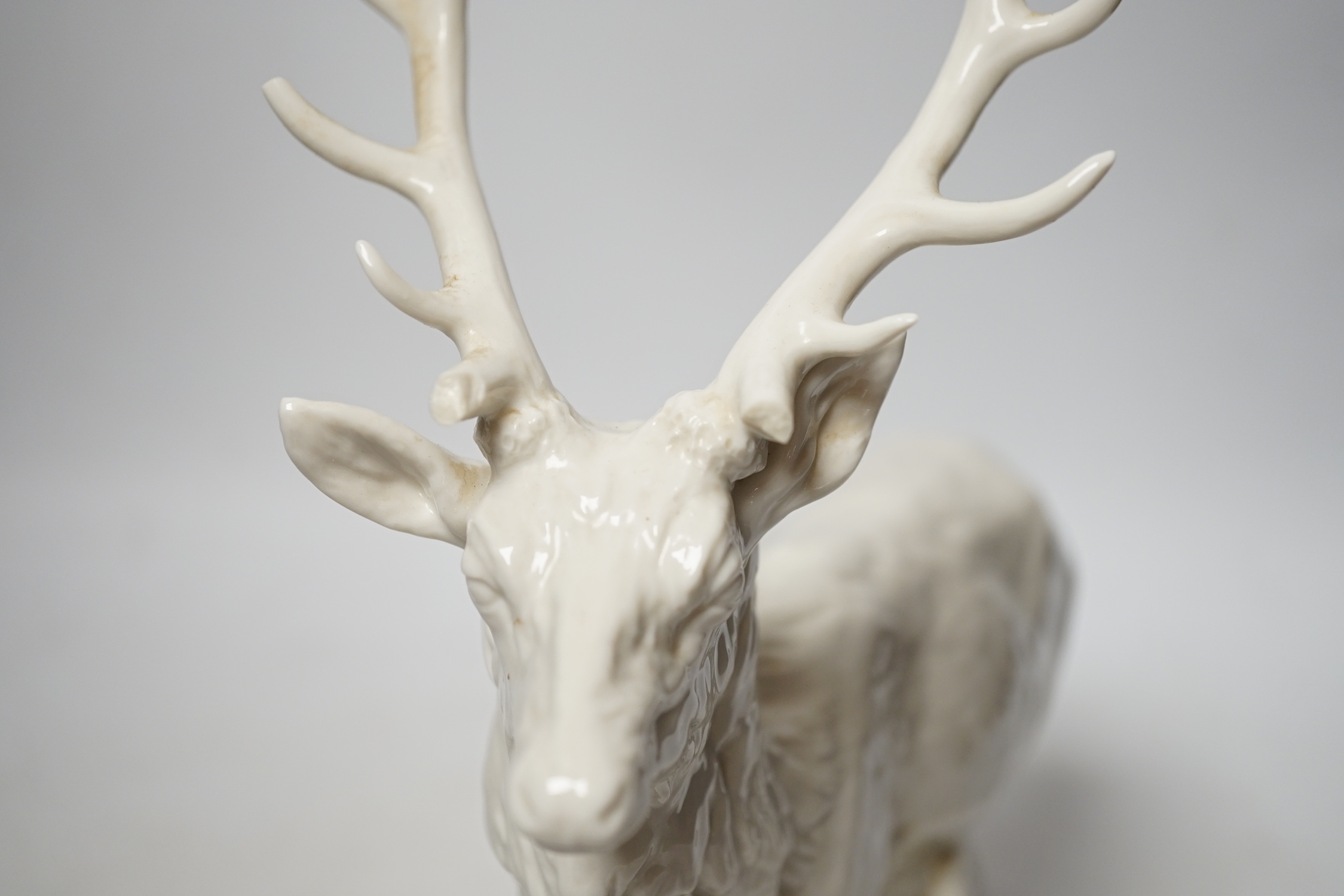 A Nymphenburg white glazed porcelain model of a stag, 31cm high